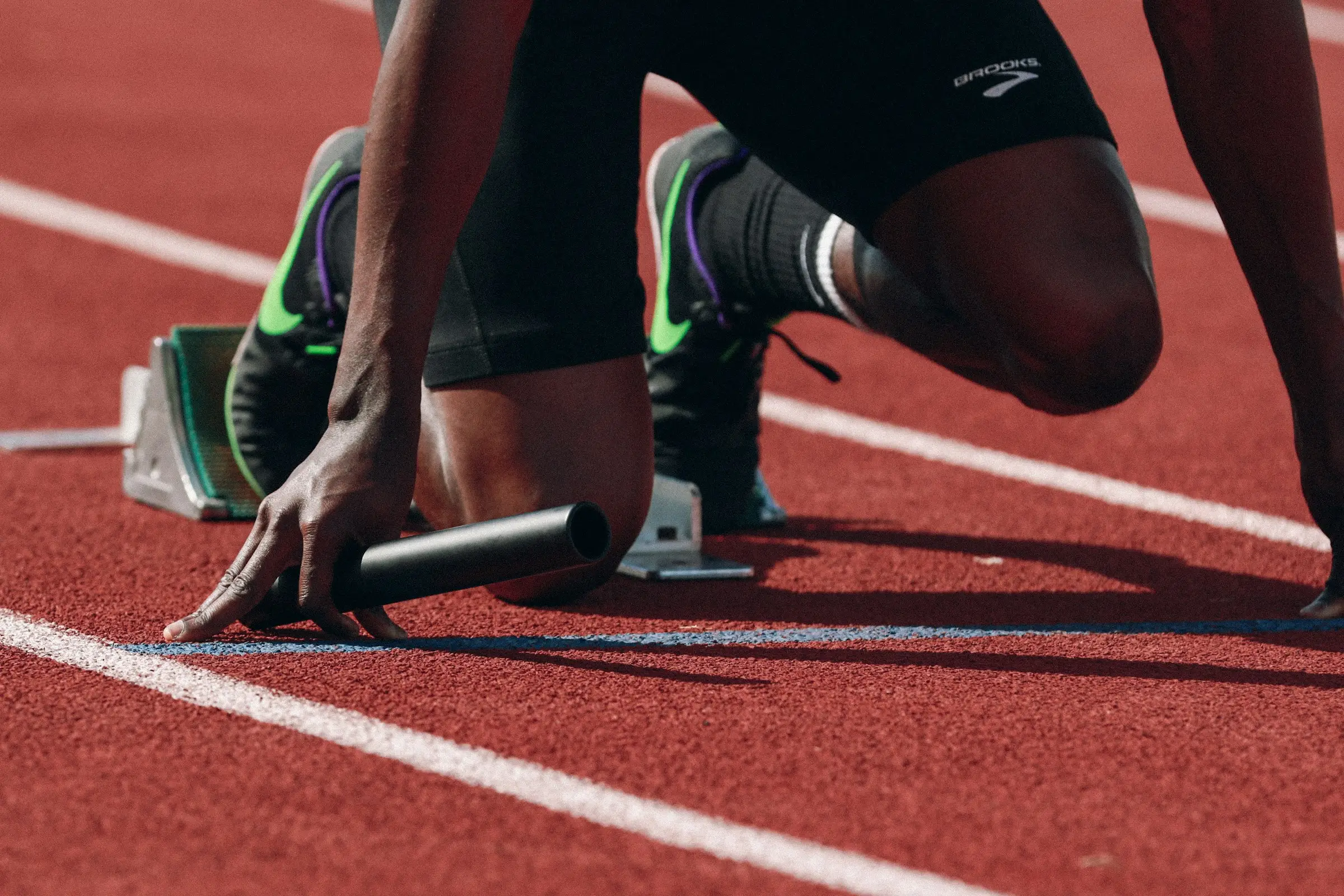 Athlete set in the starting blocks on an athletics track